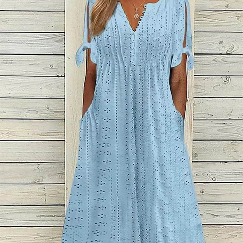 đ„°ElegĂĄns nĆi ruha V-nyakkal